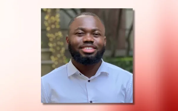 josiah hounyo headshot on red and white ombre background
